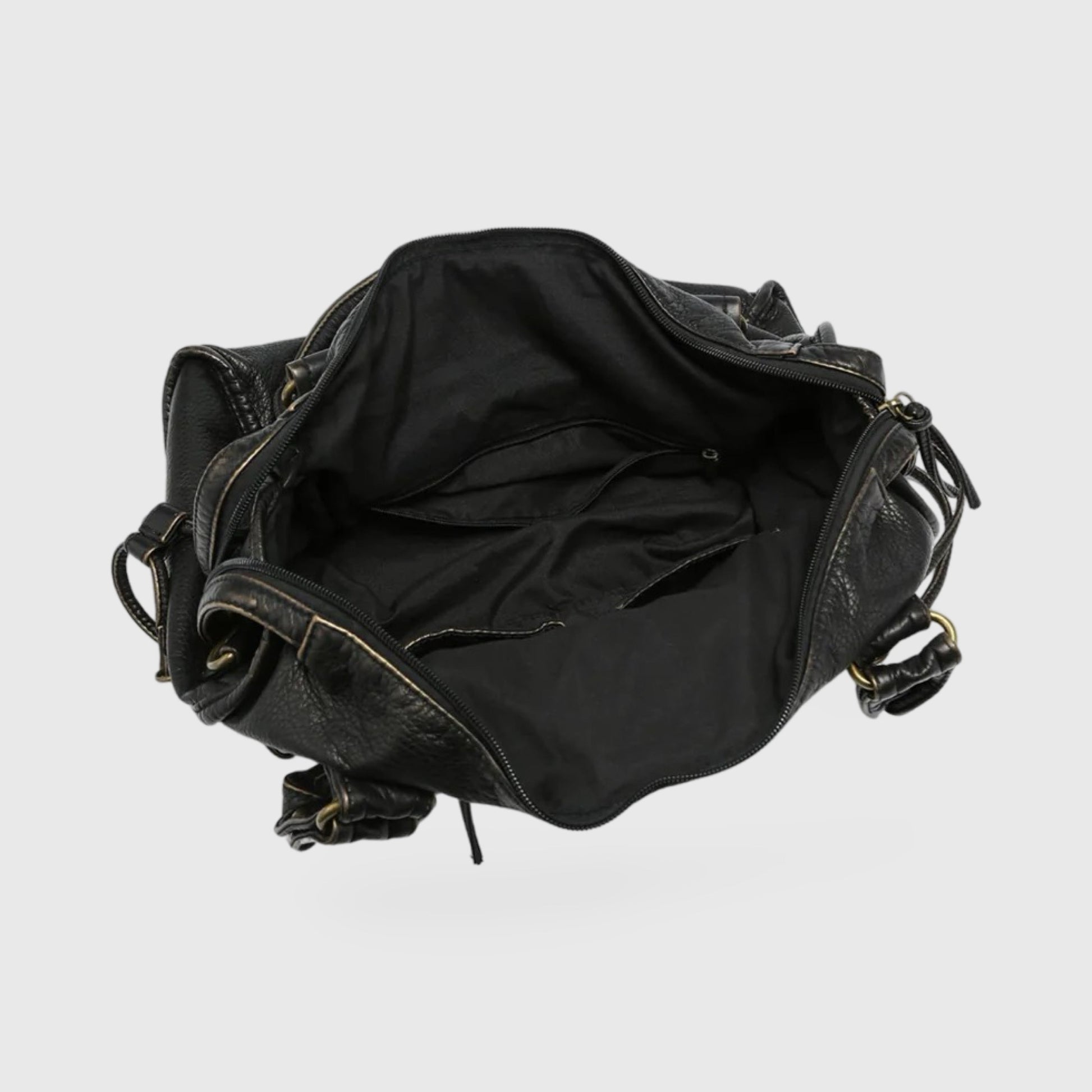 Interior view of the Celina  Black Limited Edition vegan bag showcasing spacious black lining and pockets.