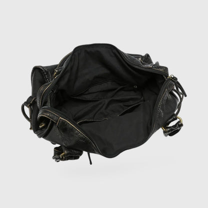 Interior view of the Celina  Black Limited Edition vegan bag showcasing spacious black lining and pockets.