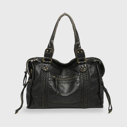 Celina  Black Limited Edition vegan bag with textured black finish and gold-tone details.